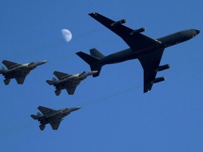 Israeli F-15 fighter jets are refueled by a Boeing 707 during an air show in the Hatzerim air force base on June 28, 2012. (AFP FILE PHOTO / JACK GUEZ)