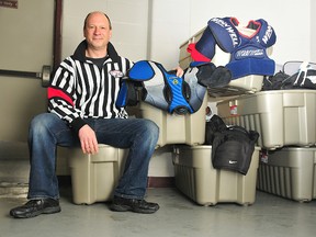Lindsey Juniper sits with six 190-litre boxes, which are filled with hockey equipment. Juniper will be bringing the equipment to Rankin Inlet, Nunavut, to donate to unprivileged players. (Aaron Hinks/Daily Herald-Tribune)