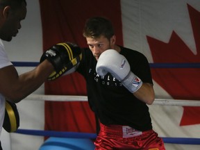 Kingston featherweight boxer Tyler Asselstine, with the help of Chris Johnson, gets in shape for his Feb. 8 bout against American Joel Diaz at Montreal’s Bell Centre. (Stan Behal/QMI Agency)