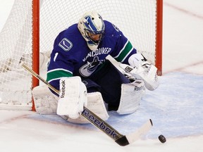 Canucks goaltender Roberto Luongo makes a save against the Avalanche during second period NHL action in Vancouver on Wednesday, Jan. 30, 2013. (Ben Nelms/Reuters)