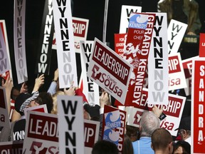 Liberals from different candidates gather in front of the stage, and listen to a band while they wait for the results of the second ballot at the Liberal leadership convention in Toronto, January 26, 2013. (Veronica Henri/QMI Agency)