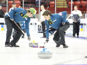Members of the Kevin Marsh rink sweep a rock during the second draw of the SaskTel Tankard in Melfort on Wednesday, January 30.