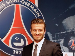 Soccer player David Beckham arrives for a news conference in Paris, January 31, 2013.    REUTERS/Philippe Wojazer