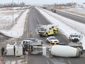 Airdrie, Alta. � Emergency crews clean up the roadway following a cement truck rollover on southbound Highway 2 at the off-ramp from Veterans Boulevard in Airdrie, Alberta on Thursday, January, 31 2013. No injuries were reported. 

JAMES EMERY/AIRDRIE ECHO/QMI AGENCY