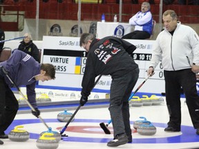 Skip Brad Heidt directs his rink's sweepers following a port shot durring action in Draw 4 at the 2013 SaskTel Tankard at the Northern Lights Palace in Melfort on Thursday, January 31