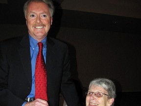 Rev. Mary Belnap is congratulated by Mayor Mike Bradley at a reception Thursday for those named to the 2012 Mayor's Honour List. Belnap was among 14 individuals and two groups recognized for their contributions to the community.