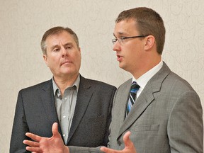 BRIAN THOMPSON, The Expositor

Brant provincial PC candidate Phil Gillies (left) listens as PC MPP Monte McNaughton discuss the party's plans for gambling in Ontario during a stop at the Best Western Brant Park Inn on Thursday morning.