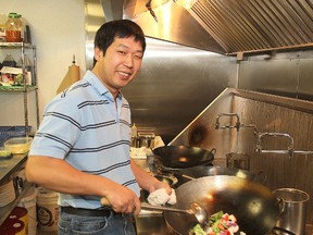 Kevin Cheng from Kai's Delight, at 680 King St. W., in Portsmouth Village, in the restaurant's kitchen. (Michael Lea/The Whig-Standard)