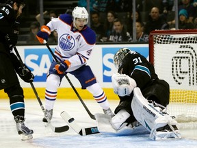 Taylor Hall is stopped by Antii Niemi in first-period action between the Oilers and Sharks Thursday in San Jose. Hall tied the game in the third period, sending it into overtime. (Reuters)