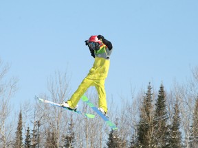 Skier Roy Compton prepares for landing off the table top kicker at Mount Evergreen's Terrain Park, Jan. 27.