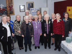 Members of the West Lorne Women's Institute received special pins at a 100-year celeberation last week. WI members are left, Olive Chambers,Theresa St. Pierre, Frances Graham, Twila McWilliam, Barbara Popham, Donna Driver, Gwen McLain, Bonita Berge, Mary Liepann, Doris Sweitzer, Nancy Lashbrook, Leola Lawrence, Dorothy Japec, Shirley Walker.