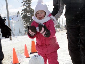 Ella Robinson tries to strike out at a popular event — turkey bowling— during the 2011 edition of the South Porcupine-Porcupine Winter Carnival. The frozen turkeys used for the event were donated to the Good Samaritan Inn homeless shelter. Residents of the East End are gearing up for the 2013 Carnival, which runs from Feb. 8-10.