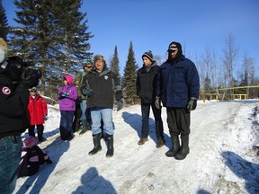 Shoal Lake 40 First Nation Chief Erwin Redsky addresses a crowd gathered at the edge of a new bridge on Freedom Road that connects the peninsula-bound community to the TransCanada highway. The community has been working toward ending its isolation for a century.