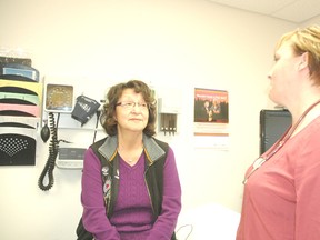 Left: Phyllis Mustus of Alexis First Nation speaks with nurse practioner Pamela Feld of Westview Health Center in an exam room located at the Alexis Health Center. Mustus appreciates the Aboriginal Women’s Outreach Clinic and said Feld is a caring nurse. She added that because Feld is a woman, it makes it easier for women utilizing the program to build a rapport with her.