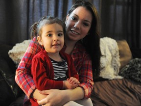 Shantel Knight and her one-year-old daughter Briar sit in their Sarnia, Ont. home Friday, Feb. 1, 2013. The 19-year-old Lambton College student overcame odds stacked against her to graduate high school. (BARBARA SIMPSON, The Observer)