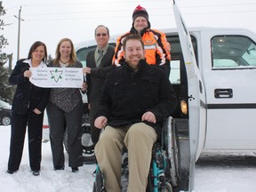 Community Living Timmins (CLT) is ready to hit the road with its brand new wheelchair-accessible vehicle, the MV1 (or RoboCop, according to staff). Wheelchairs can be securely strapped in the passenger seat area without having to remove the user from the chair. The MV1 was purchased through a grant from the Ontario Trillium Foundation. Showing off the new wheels were, back row, from left, CLT executive director Johanne Rondeau-Bernier, CLT manager of community services and development Tammie Molenaar, and CLT president Robert Tremblay, and CLT client and volunteer Raymond Campsall; front row, CLT supervisor of community services Darrell Sarrasin.