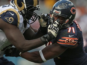 Israel Idonije #71 of the Chicago Bears rushes against Barry Richardson #79 of the St. Louis Rams at Soldier Field on September 23, 2012 in Chicago, Ill. The Bears defeated the Rams 23-6.  Jonathan Daniel/Getty Images/AFP