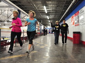 Laurie Bradley, left, and Leanne Van Bavel zip past Algonquin College in the Ottawa Valley dean Karen Davies and Vicky Faught on the promenade at the Pembroke Memorial Centre, where the Spread-the-Net Walkathon was taking place on Thursday, Jan. 31. For more community photos please visit our website photo gallery at www.thedailyobserver.ca.