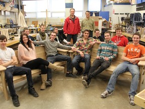 SCITS construction students, in this undated photo, show off the benches they've crafted for the Huron House Boys' Home. Pictured here, in front, are Macauley Clegg, Leah Gibbs, Joseph Maw, Joshua Ravenhorst, Nathan Chaulk and Daniel Anderson. In the back are Jared Smalls, David Belet, Chris Mazur, Mick Mullen, of the Huron House Boys' Home; teacher Eric Pries, Andy Letourneau and Jamie Gagnon. SUBMITTED PHOTO / THE OBSERVER