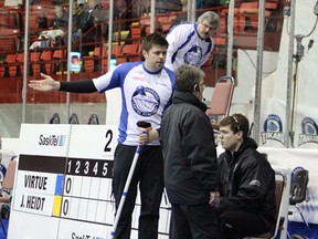 Virtue Rink third Braeden Moskowy presents his case to an unsympathetic official in the second end of the B Event final after his teammate Chris Schille was ejected from the game.