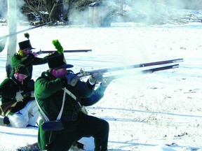 Members of the Forsyth's Rifles re-enactors' group fire their rifles at Lighthouse Point in Ogdensburg. PHOTO COURTESY MICHAEL WHITTAKER