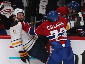 Canadiens forward Brendan Gallagher gives Sabres defenceman Mike Weber a little chin music at the Bell Centre in Montreal, Que., Feb. 2, 2013. (CHRISTINNE MUSCHI/Reuters)
