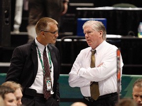 Philadelphia Flyers GM Paul Holmgren (left) talks with former Toronto Maple Leafs GM Brian Burke at the 2011 NHL draft. (QMI Agency file)