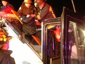 First responders assist injured passengers from a charter bus that crashed in Boston, Massachusetts February 2, 2013. (Boston Fire Dept./Handout)