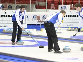 Skip Brock Virtue gives sweepers direction on a rock during his semi-final win over the Kevin Marsh rink.