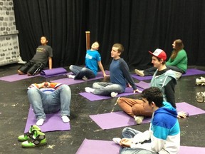 Students enjoy stretching out during a yoga session. SUPPLED PHOTO