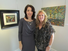 A show by artists Lisa Matlovich, left, and Karen Benusik opened Sunday at Gallery in the Grove, upstairs at the library in Bright's Grove. The show runs through Feb. 23. PAUL MORDEN/THE OBSERVER/QMI AGENCY