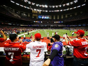 San Francisco 49ers quarterback Colin Kaepernick walks on the field past fans before the 49ers play the Baltimore Ravens in the NFL Super Bowl XLVII football game in New Orleans, Louisiana, February 3, 2013.  (REUTERS)