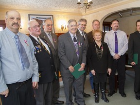 Kirkland Lake and area residents were honoured with Diamond Jubilee Medals by Timmins-James Bay MP Charlie Angus (back row, center) Honourees included, from left, Ron Lalonde, Marcel Nault, Jean Claude Carriere, Norm Connelly, Lorraine Robazza, Terry Fiset (behind), David McIntyre (accepting on behalf of his father Fred McIntyre) and Steven Yee.