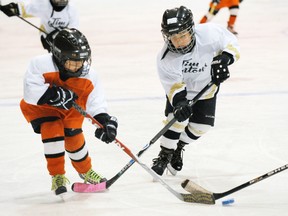 SARAH DOKTOR Simcoe Reformer
Simcoe Flyers' Owen Bennett and Simcoe Penguins' Brayden Dempsey chase down the puck during the consolation championship game at the Simcoe Lions' Tyke Tournament at Talbot Gardens on Feb. 3. The Penguins' won 3-2.