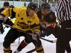 Whitby's Darren Doherty and Brantford's Joel Prpic face off in the first period Friday during Allan Cup Hockey action at the Brantford Civic Centre on Feb. 3, 2013.
DARRYL G. SMART/Brantford Expositor/QMI Agency FILE PHOTO