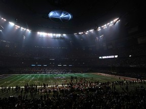The Superdome is covered in partial darkness during a power outage in the third quarter of the Super Bowl game between the 49ers and Ravens in New Orleans on Sunday, Feb. 3, 2013. (Jonathan Bachman/Reuters)