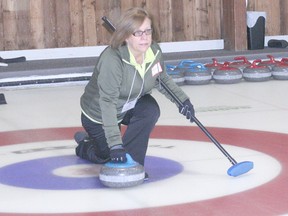 Marianne Simpson of Team Simpson throws a rock during the Curling for Cancer event held on Feb. 2 at the Chatham Granite Club. The 20th annual event attracted 40 curlers and raised $9,250 for the Canadian Cancer Society. Each of the 10 rinks played two six-end games.