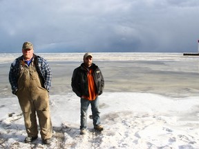 Jim Granger, left, and Darren Propper, of Granger’s Ice Fishing are among the Long Point-area operators feeling the financial heat from back-to-backs unseasonably mild winters. Operators and fishers alike are hoping colder weekend temperatures will continue and allow them to salvage at least a partial season. Jeff Tribe/Tillsonburg News