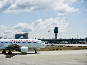 Air Canada plane at Vancouver International Airport in Vancouver, British Columbia, Thursday May 24, 2012. (CARMINE MARINELLI/QMI AGENCY)