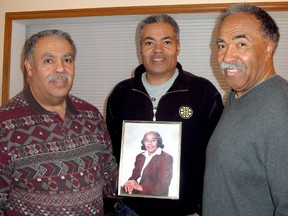 Farmer and humanitarian, Delores Shadd, died last Thursday, Jan. 31, 2013,  at age 87. Her sons, from left, Terence, of Merlin, Darrell, of Shrewsbury, and Duane, of Kitchener, hold the photograph of their mother, which was taken in 1988 when she was the first recipient of the Chatham-Kent YMCA Peace Medallion. Photo taken, Monday, Feb. 4, 2013 in Merlin, Ont. (ELLWOOD SHREVE/ THE CHATHAM DAILY NEWS/ QMI AGENCY)