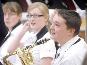 Mitchell District High School jazz band baritone saxophone player Pete Maloney takes some cues from adjudicator Darryl Eaton during the Kiwanis Festival of the Performing Arts band day at Stratford Central last April. (SCOTT WISHART The Beacon Herald)