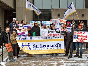 KARA WILSON, for The Expositor 

A group gathers at city hall Monday to kick off activities for Youth Homelessness Week. The group marched to the Youth Resource Centre at 331 Dalhousie St., where refreshments were served.