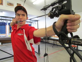 Jon-Wesley Skinner takes aim at Algoma Rod and Gun Club Sunday evening. The local teen recently bagged second place in his class at the International Bowhunting Organization 2013 Indoor World Championship in Cleveland, Ohio.