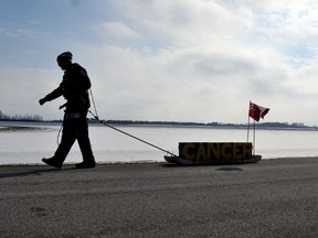 Mike Duhacek, who is doing a death march for cancer from Windsor to Ottawa, pulls a sled along River View Line and made his way through Chatham-Kent Tuesday February 05, 2013. Duhacek, whose mother Liz is fighting cancer, hopes  to raise funds for research. DIANA MARTIN/ THE CHATHAM DAILY NEWS/ QMI AGENCY