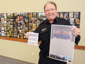 Wetaskiwin Fire Services Fire Chief Merlin Klassen poses with a poster and a ticket to the Wetaskiwin Firefighters Ball to be held March 2, 2013, at the Drill Hall. The event celebrates 110 years of fire service within the community.