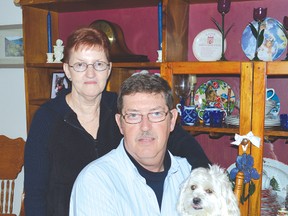 This is the modern face of Alzheimer’s disease say Shirley and Tim Masson. Shirley was diagnosed with Alzheimer’s disease in August of 2012. They are accompanied in the photo by Becky, the shih tzu-poodle mix canine.
Photo by KEVIN McSHEFFREY/THE STANDARD/QMI AGENCY