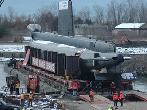 HMCS Ojibwa is navigated into position for its offload in Port Burwell last November. (Nick Lypaczewski Times-Journal)