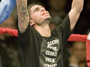 Sarnia's Steve Molitor, pictured here after defeating South African Takalani Ndlovu for the I.B.F. Junior Featherweight Championship title on March 27, 2010, announced his retirement from boxing last week. FRED THORNHILL/REUTERS