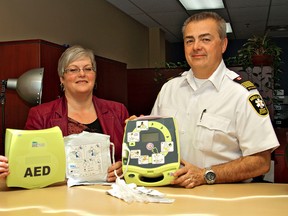 KARA WILSON, for The Expositor

Jill Thompson, Brantford's health, wellness and safety manager, and Russ King, 
Brant County EMS duty manager, say regular maintenance of automated external defibrillators in private locations is a must.