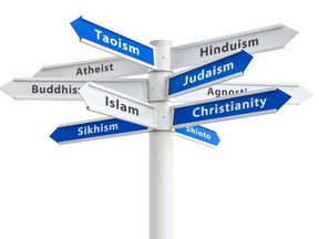 Major religions of the world on a crossroads sign. (Fotolia.com)
